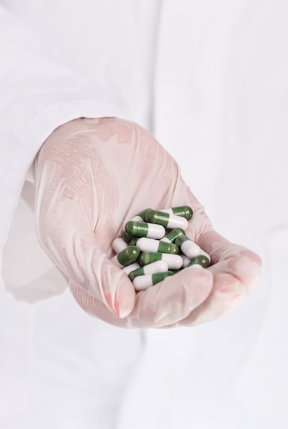 Doctor holding heap of pills