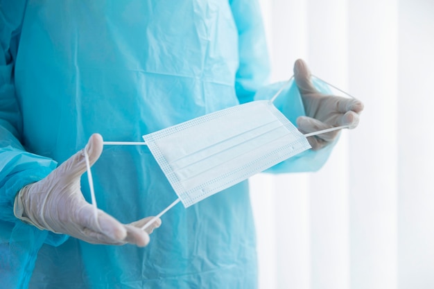 Doctor holding a medical mask