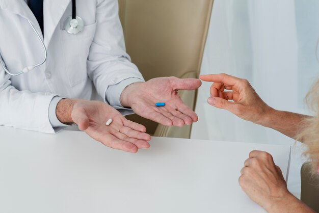 Doctor holding pills in hands