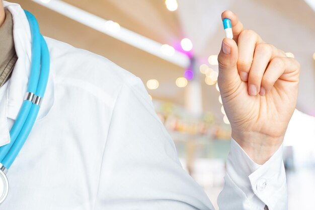 Doctor holding pills