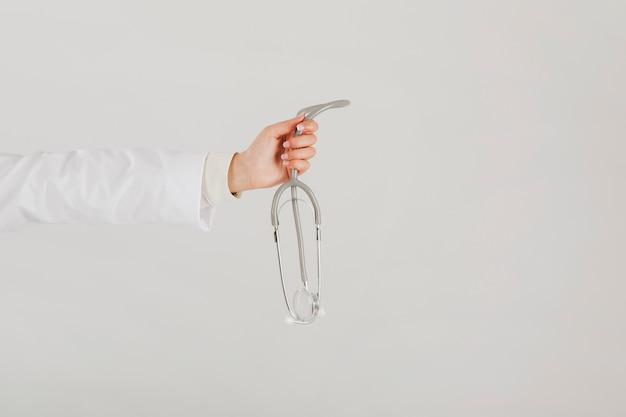 Doctor holding stethoscope in hand