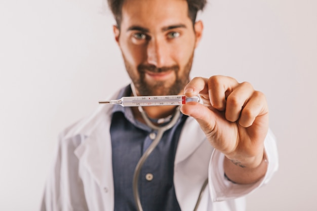 Doctor holding a thermometer