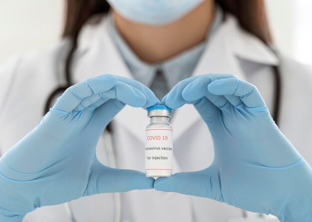 Doctor holding a vaccine recipient