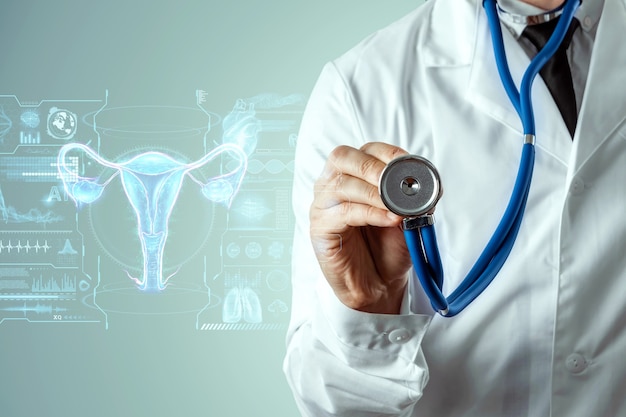 Doctor and hologram of the female organ of the uterus. medical examination, women's consultation, ultrasound, gynecology, obstetrics, pregnancy, modern medicine.