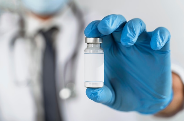 Doctor looking at a vaccine recipient close-up