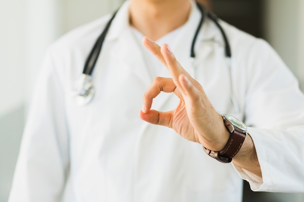 Doctor making ok gesture with hand