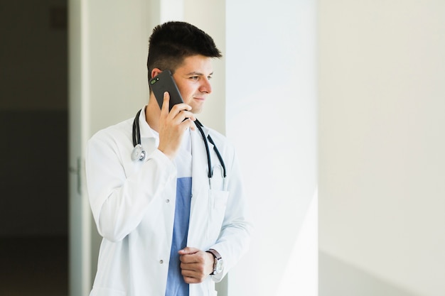 Doctor making phone call