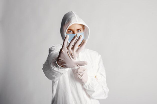 Doctor in a medical mask. Coronavirus theme. Isolated over white background