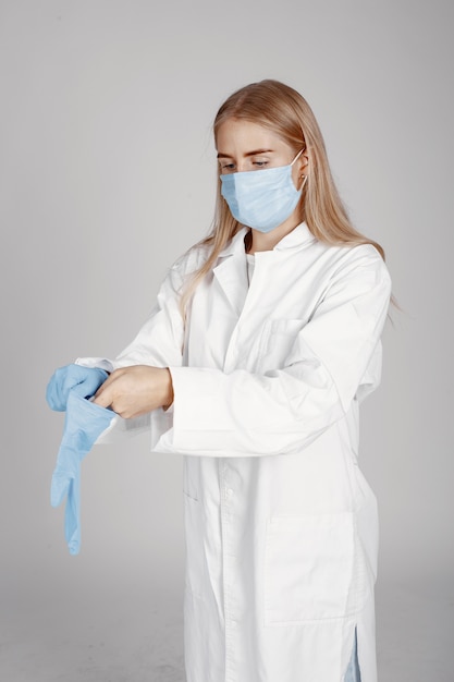 Doctor in a medical mask. Coronavirus theme. Isolated over white background