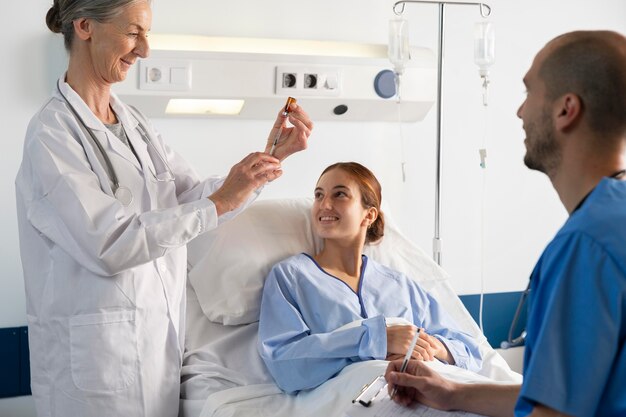 Doctor and nurse helping woman