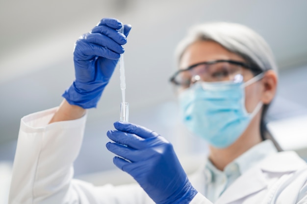 Free photo doctor performing medical research in lab