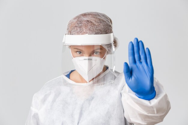 Doctor in personal protective equipment posing