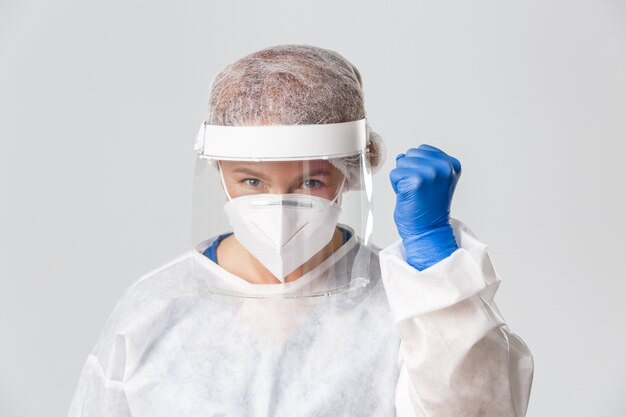 Doctor in personal protective equipment posing