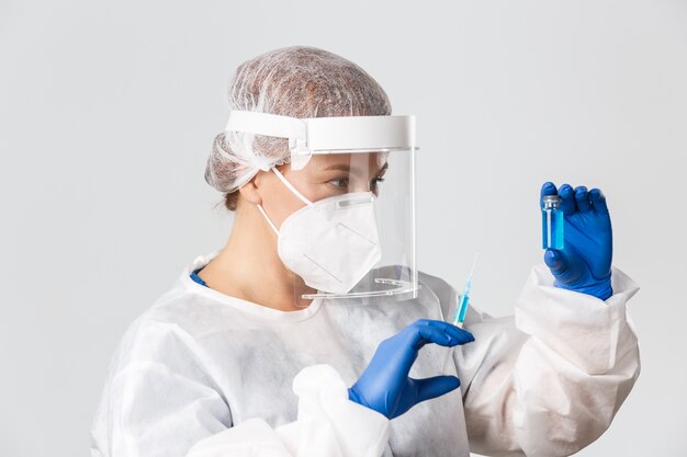 Doctor in personal protective equipment posing