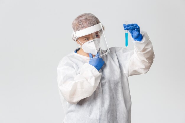 Doctor in personal protective equipment posing