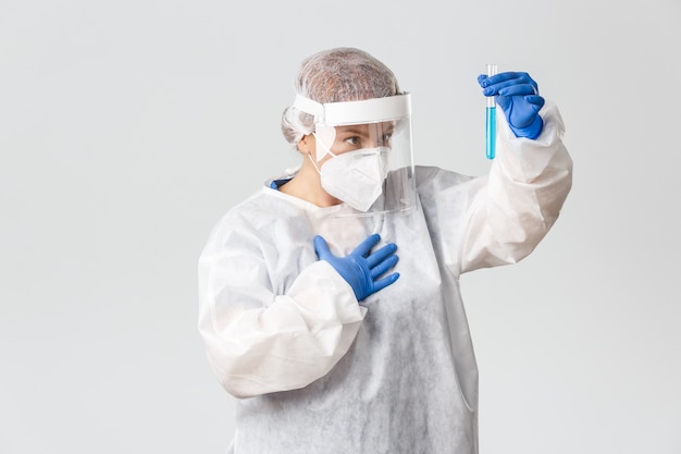 Doctor in personal protective equipment posing