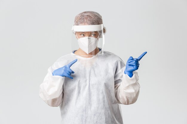 Doctor in personal protective equipment posing