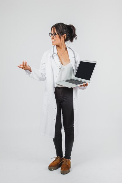Doctor posing with laptop