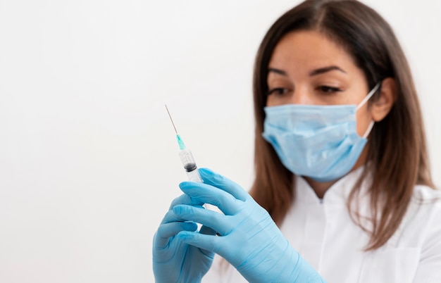 Doctor preparing medical vaccine