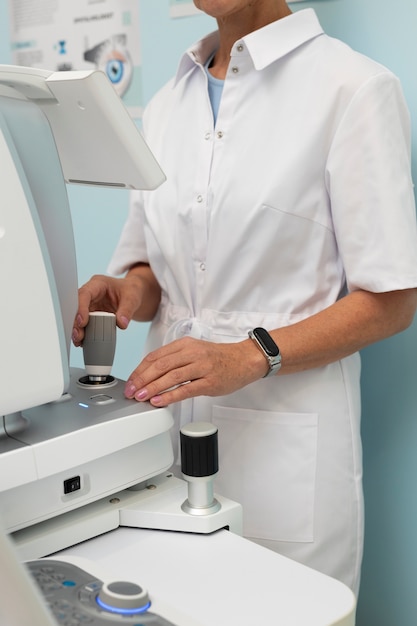 Free photo doctor preparing ophthalmologist's office