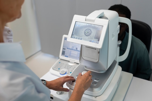 Free photo doctor preparing ophthalmologist's office