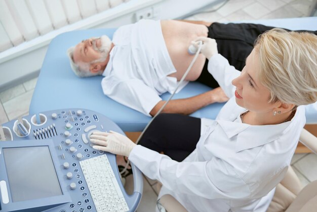 Doctor providing exam with modern med equipment