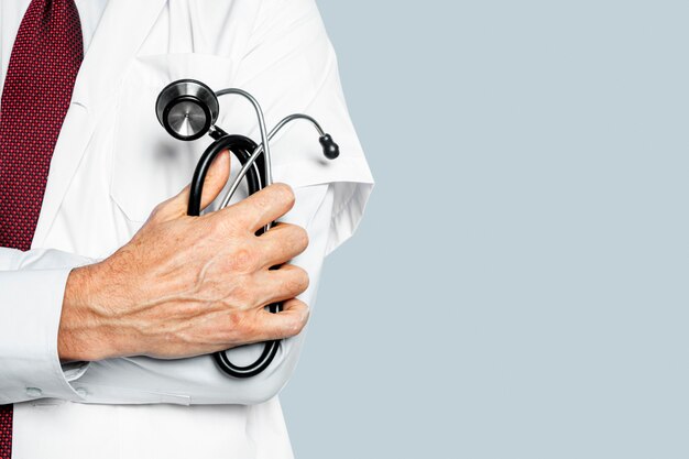 Doctor's hand holding a stethoscope closeup