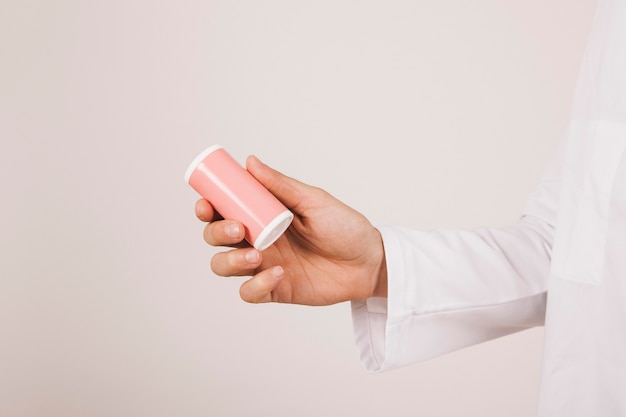 Doctor's hand with a medication