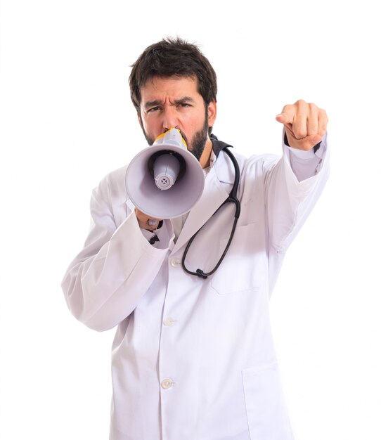 Doctor shouting over isolated white background