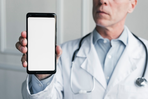Doctor showing a mobile phone