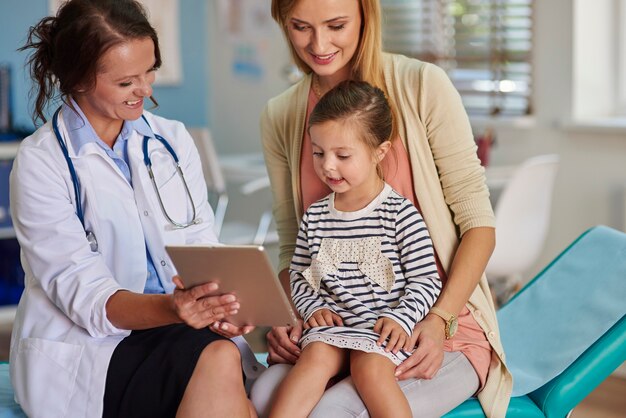 Doctor showing results on the tablet