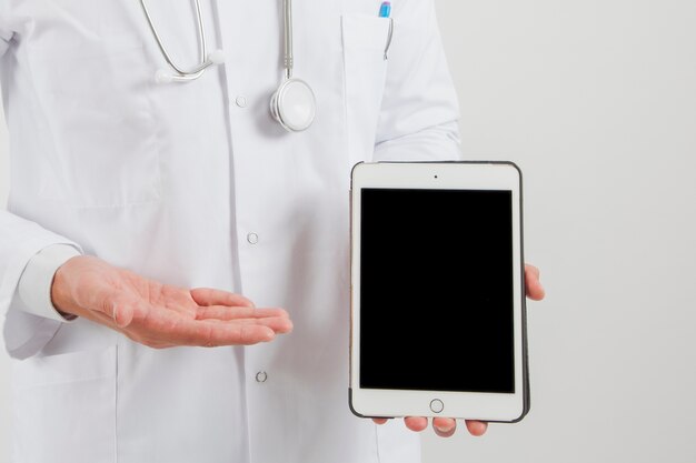 Doctor showing tablet