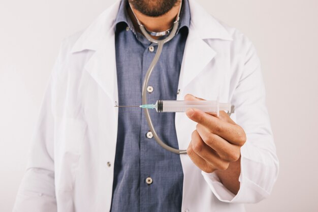 Doctor showing a vaccine