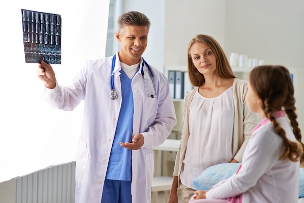 A doctor showing an x-ray