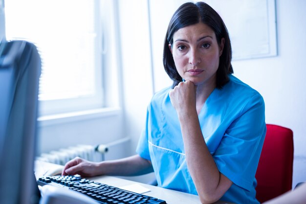 Doctor sitting in medical office at hospital