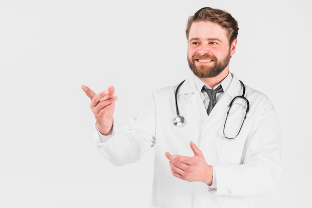 Doctor smiling and pointing out 