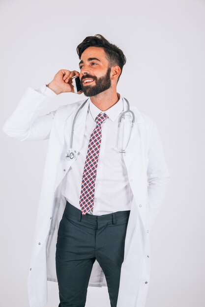 Doctor smiling and talking on the phone