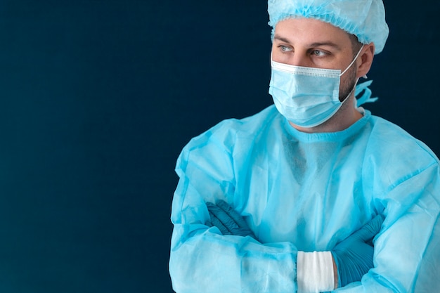 Doctor in special equipment holding the covid 19 vaccine