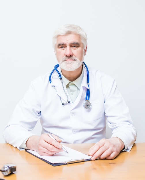 Doctor standing with a folder and a stethoscope