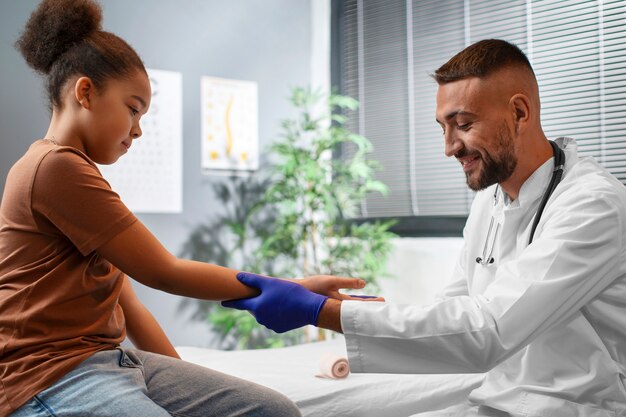 Doctor taking care of afro-american child