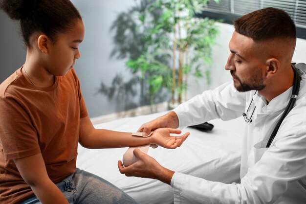 Doctor taking care of afro-american child