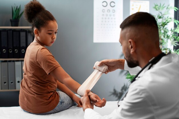 Doctor taking care of afro-american child