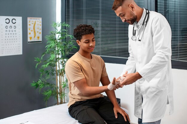 doctor taking care of afro-american child