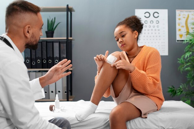 doctor taking care of afro-american child