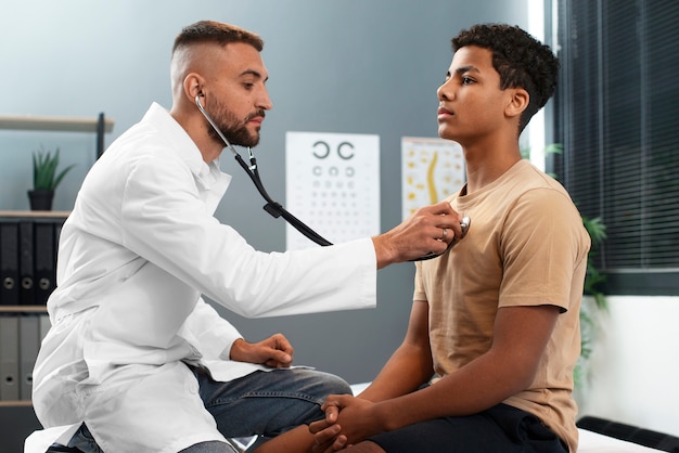 Doctor taking care of afro-american child