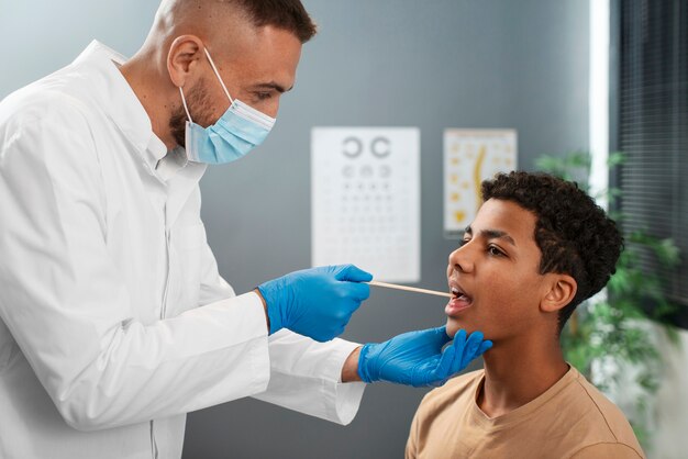 doctor taking care of afro-american child