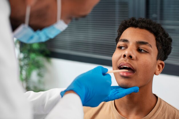 Doctor taking care of afro-american child