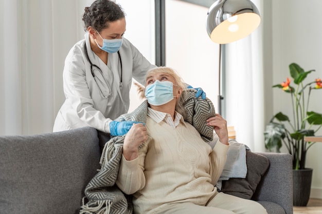 Free photo doctor taking care of senior woman