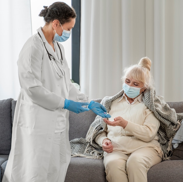 Free photo doctor taking care of senior woman