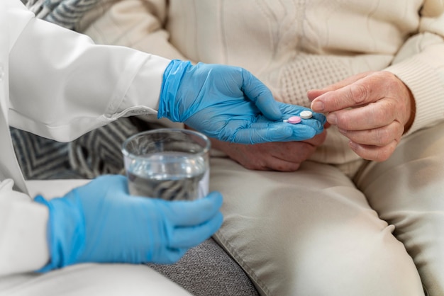 Free photo doctor taking care of senior woman